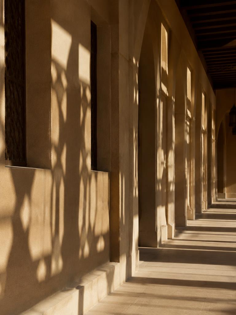 Shaded arcade with geometric shadows in Dubai