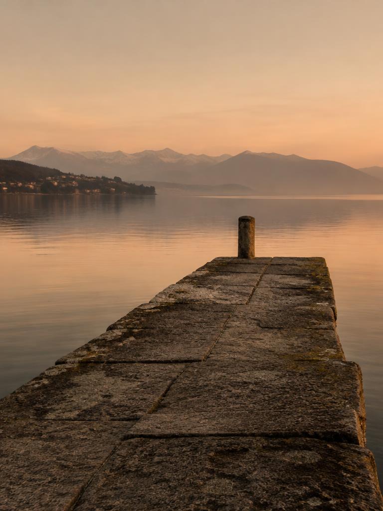 Stone pier on Lake Zug at dawn